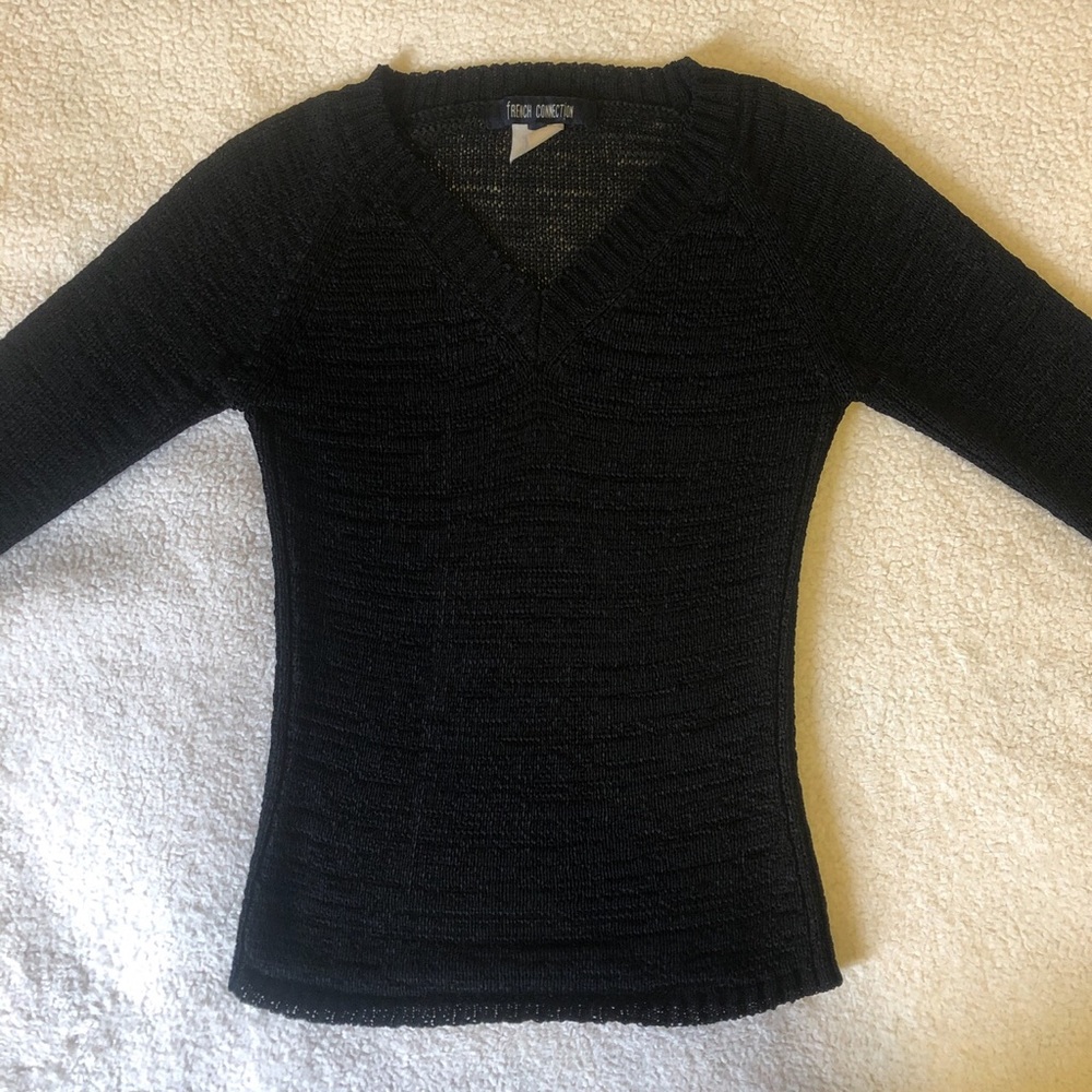 Black sweater, rough material